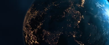 View of Earth at night, symbolizing StoneX Wealth Management's global market access and international securities transaction capabilities