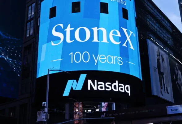 StoneX 100 years anniversary displayed on Nasdaq building, symbolizing its global presence and stability.